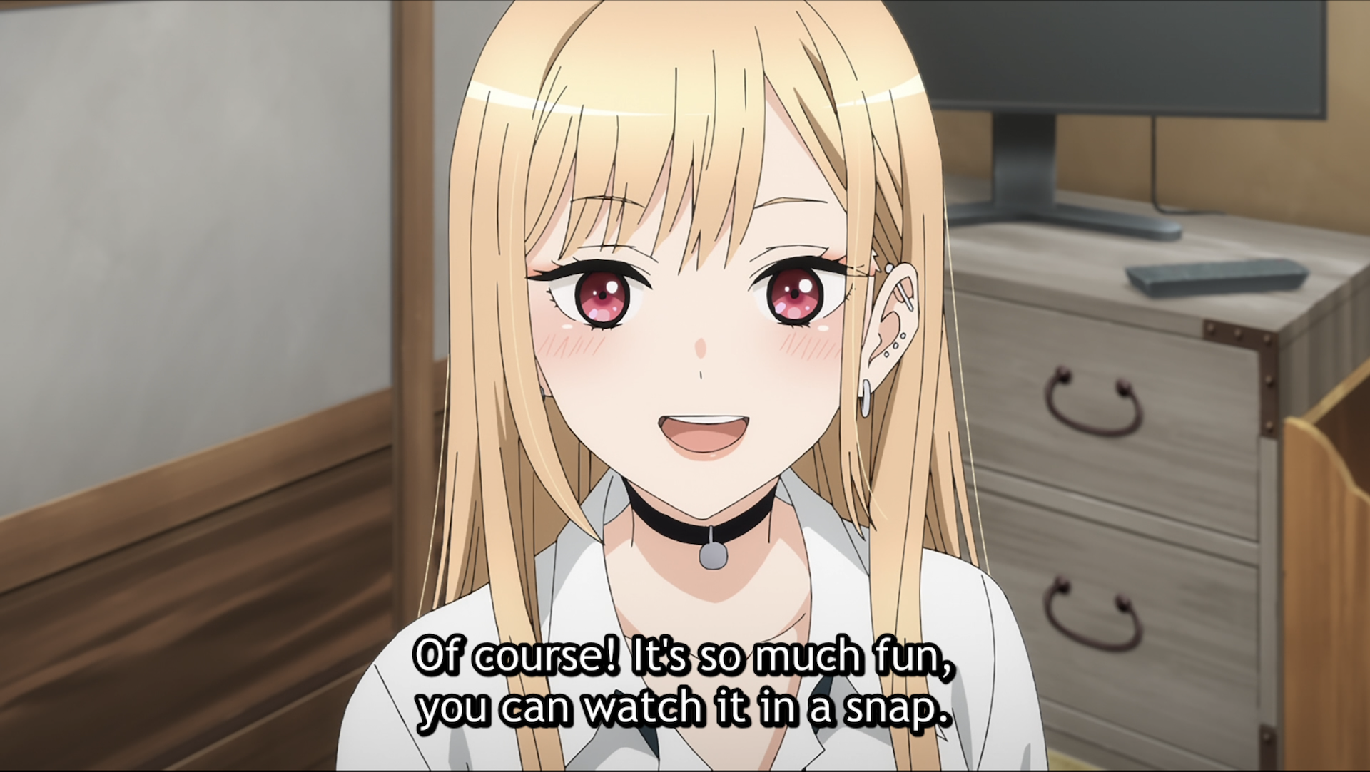A picture of Marin from My Dress-Up Darling facing the viewer saying "Of course! It's so much fun, you can watch it in a snap."